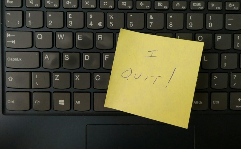 keyboard with sticky note that says "I quit"