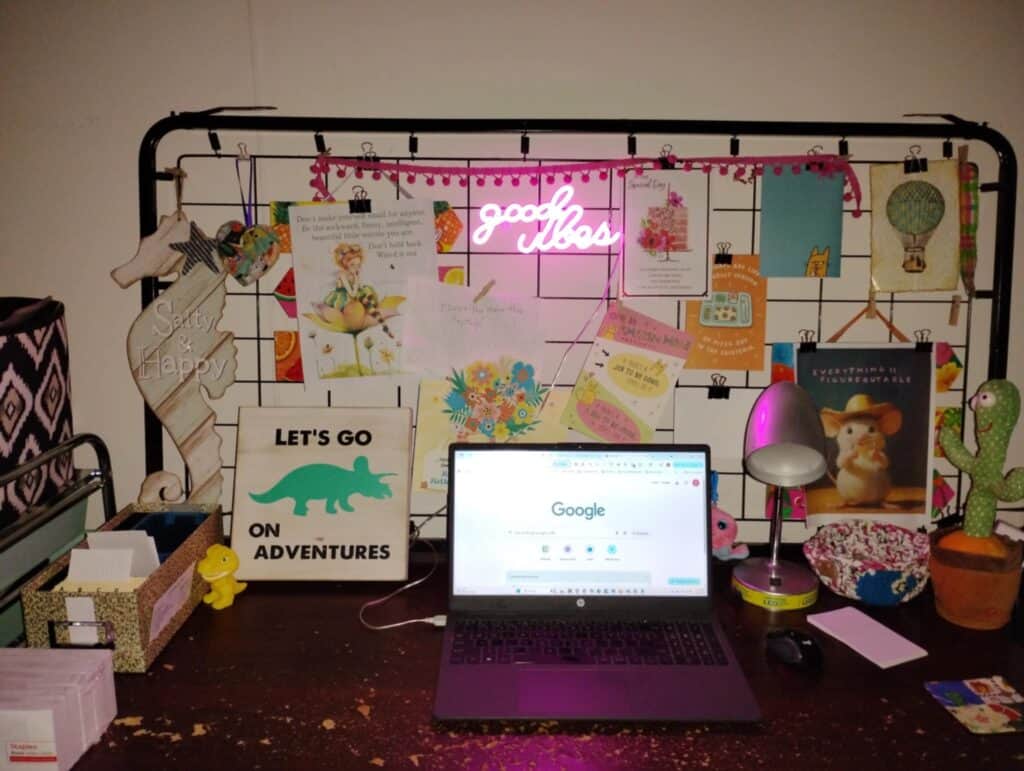 desk with laptop and an inspiration wall